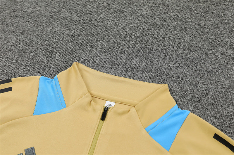 Chándal Oficial Argentina 24/25 - Edición Dorada con Detalles Celestes y Grises