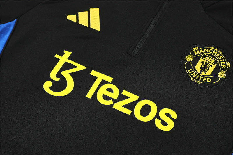 MANCHESTER UNITED – CONJUNTO DE ENTRENAMIENTO NEGRO/AMARILLO 2025/26