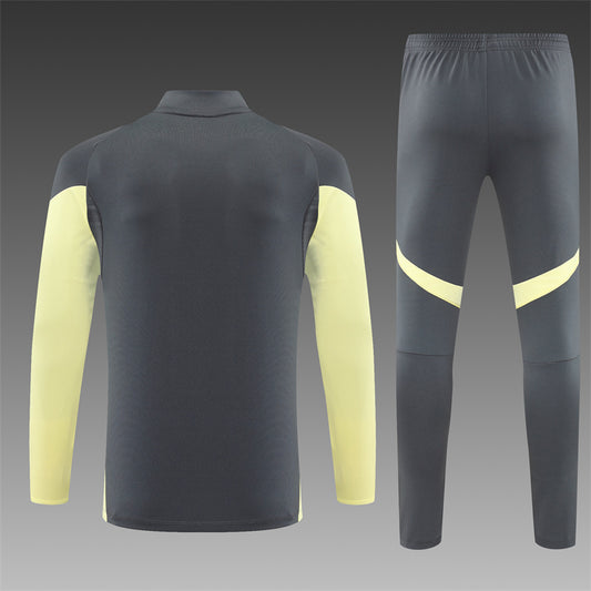 REAL MADRID – CONJUNTO DE ENTRENAMIENTO GRIS/AMARILLO 2025/26