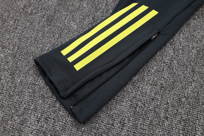 Chándal Real Madrid 2025/2026 – Negro con Detalles Amarillos