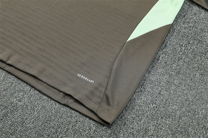 Real Madrid 25/26 – Chándal de entrenamiento tono carbón con detalles verde menta