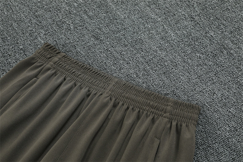 Real Madrid 25/26 – Chándal de entrenamiento tono carbón con detalles verde menta