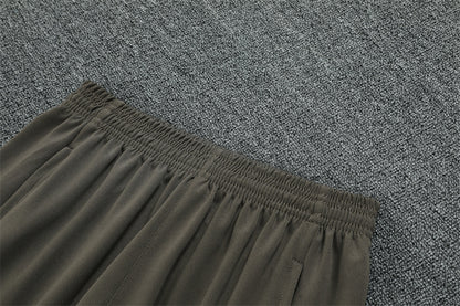 Real Madrid 25/26 – Chándal de entrenamiento tono carbón con detalles verde menta