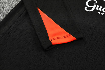 Chándal Brasil 2025/26 – Negro con detalles naranja