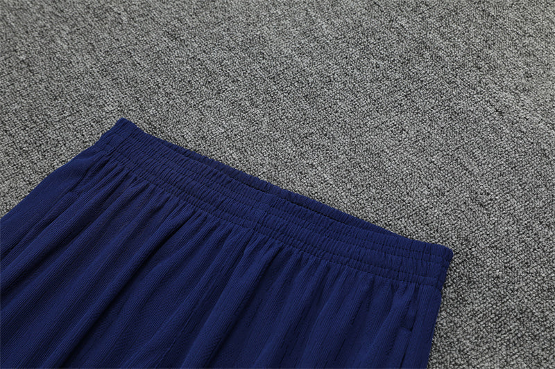 FC Barcelona 25/26 – Training Set (Azul marino con efecto wave naranja/blanco)