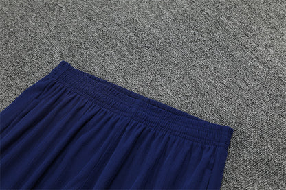 FC Barcelona 25/26 – Training Set (Azul marino con efecto wave naranja/blanco)