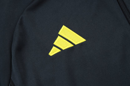 Chándal Real Madrid 2025/2026 – Negro con Detalles Amarillos