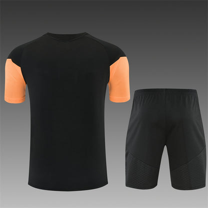 Conjunto Arsenal Entrenamiento Negro y Naranja 26/27