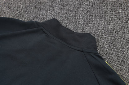 Chándal Real Madrid 2025/2026 – Negro con Detalles Amarillos