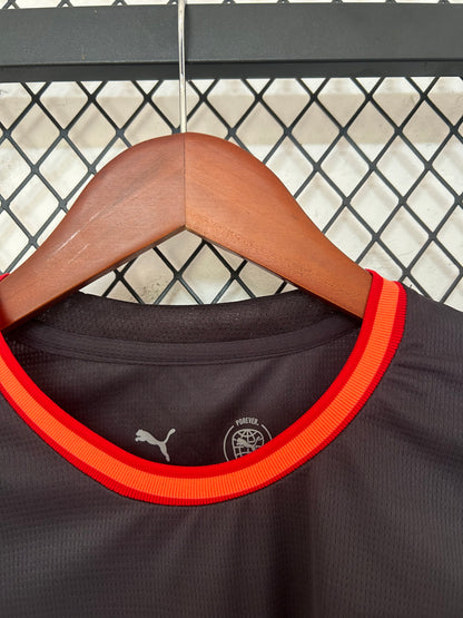 Camiseta AC Milan 2026/2027 Alternativa – Negra con Detalles Naranja Oficial Puma
