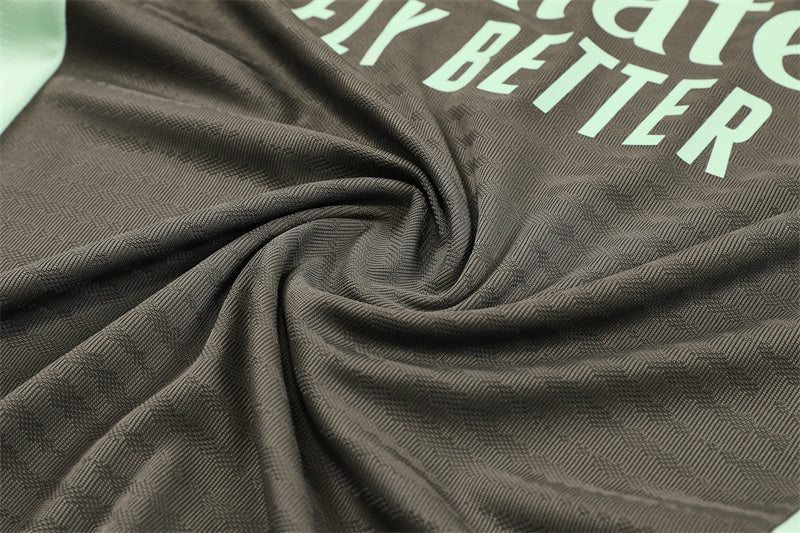 Real Madrid 25/26 – Chándal de entrenamiento tono carbón con detalles verde menta