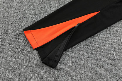 Chándal Brasil 2025/26 – Negro con detalles naranja