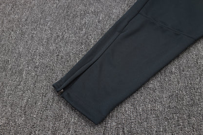 Chándal Real Madrid 2025/2026 – Negro con Detalles Amarillos