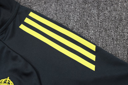 Chándal Real Madrid 2025/2026 – Negro con Detalles Amarillos