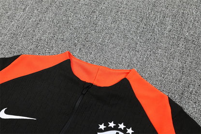 Chándal Brasil 2025/26 – Negro con detalles naranja