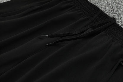 Real Madrid – Conjunto de Entrenamiento Negro/Naranja (Edición Impacto)