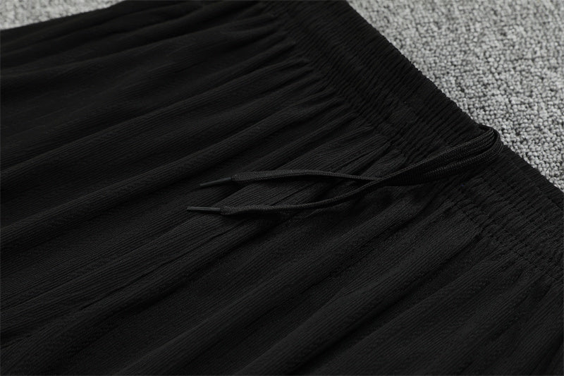 Chándal Brasil 2025/26 – Negro con detalles naranja