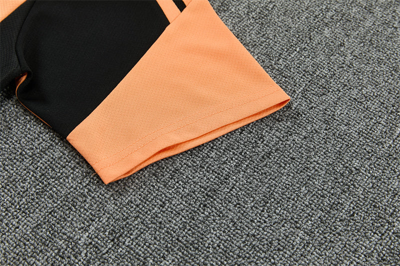 Conjunto Arsenal Entrenamiento Negro y Naranja 26/27