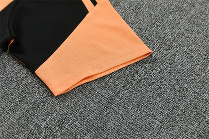 Conjunto Arsenal Entrenamiento Negro y Naranja 26/27