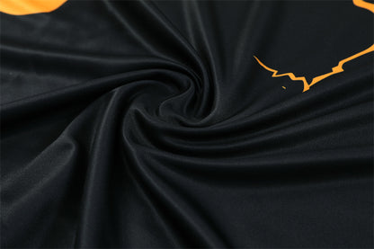 Real Madrid – Conjunto de Entrenamiento Negro/Naranja (Edición Impacto)