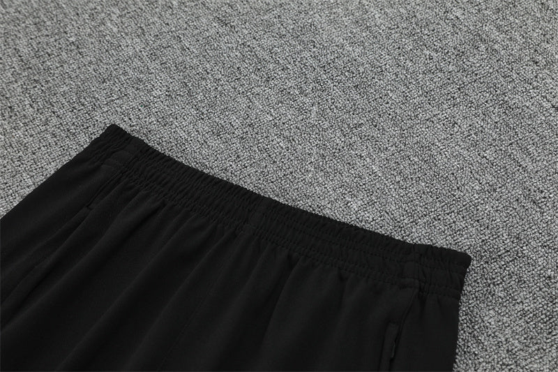 Real Madrid – Conjunto de Entrenamiento Negro/Naranja (Edición Impacto)