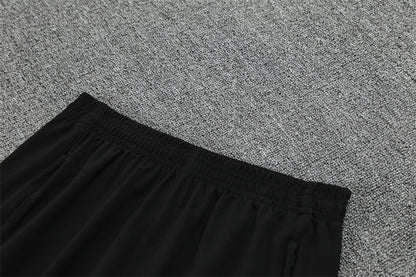 Real Madrid – Conjunto de Entrenamiento Negro/Naranja (Edición Impacto)