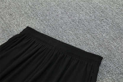 Chándal Brasil 2025/26 – Negro con detalles naranja