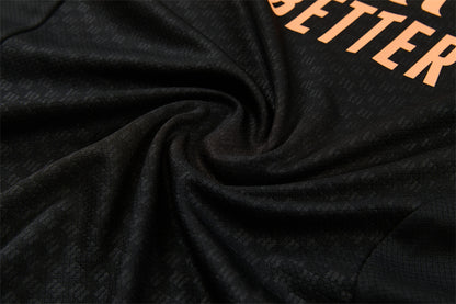 Conjunto Arsenal Entrenamiento Negro y Naranja 26/27