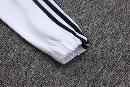 Chándal Real Madrid 2025/2026 – Blanco, Negro y Lima