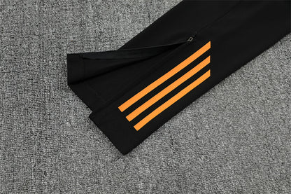 Real Madrid – Conjunto de Entrenamiento Negro/Naranja (Edición Impacto)