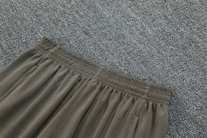 Real Madrid 25/26 – Chándal de entrenamiento tono carbón con detalles verde menta