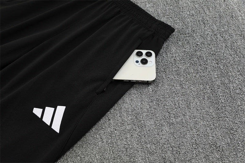 Real Madrid – Conjunto de Entrenamiento Negro/Naranja (Edición Impacto)