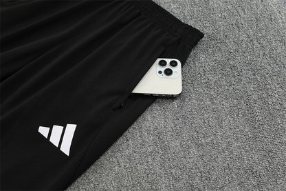 Real Madrid – Conjunto de Entrenamiento Negro/Naranja (Edición Impacto)