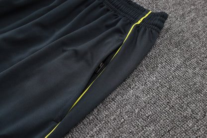 Chándal Real Madrid 2025/2026 – Negro con Detalles Amarillos