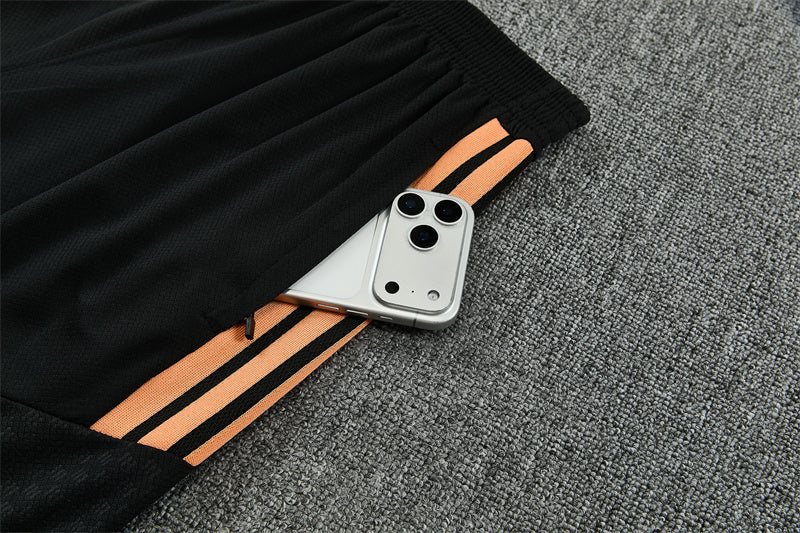 Conjunto Arsenal Entrenamiento Negro y Naranja 26/27