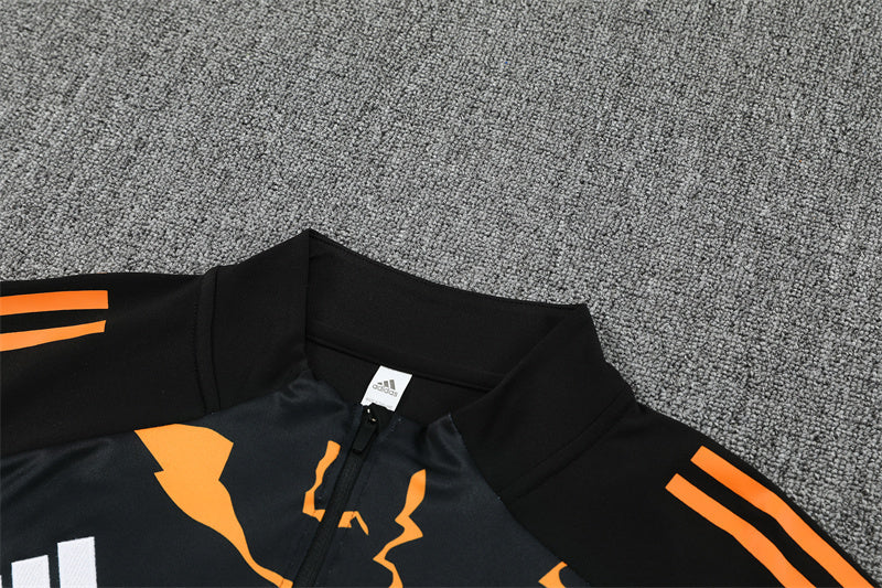 Real Madrid – Conjunto de Entrenamiento Negro/Naranja (Edición Impacto)