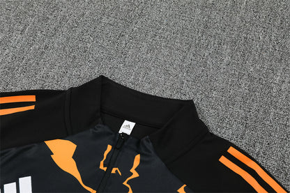 Real Madrid – Conjunto de Entrenamiento Negro/Naranja (Edición Impacto)