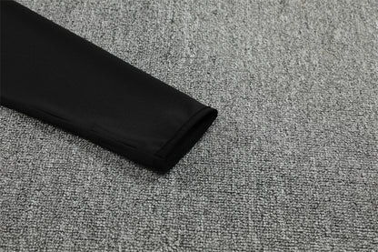 Real Madrid – Conjunto de Entrenamiento Negro/Naranja (Edición Impacto)