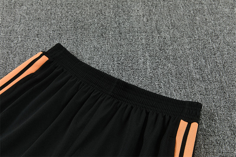 Conjunto Arsenal Entrenamiento Negro y Naranja 26/27