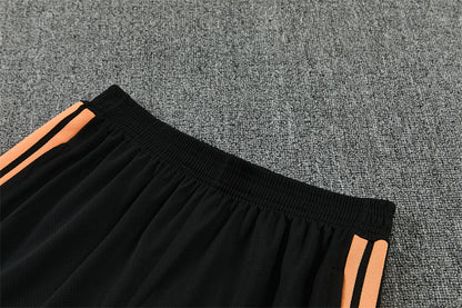 Conjunto Arsenal Entrenamiento Negro y Naranja 26/27