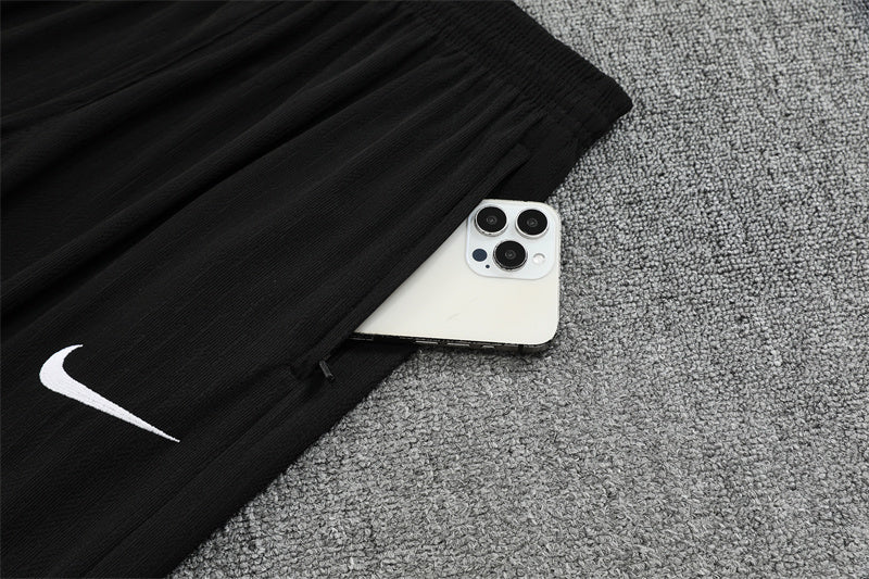 Chándal Brasil 2025/26 – Negro con detalles naranja